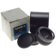 Yashica x 2 Auto Tele Converter Mint in box with caps. Perfectly clean glass.