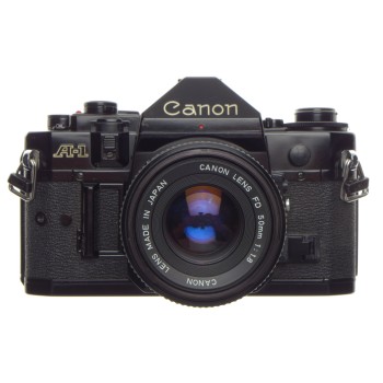 CANON A-1 black 35mm SLR film camera with FD 50 1:1.8 lens filter, strap and cap