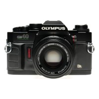 Olympus OM-40 SLR film camera set with 50mm f1.8 lens papers